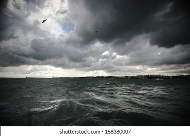 Dark Stormy Clouds And Sea.