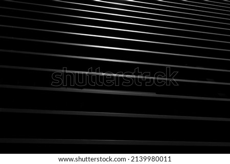 Dark striped abstract background. Facade. Lines. Geometric wallpaper. December 2022