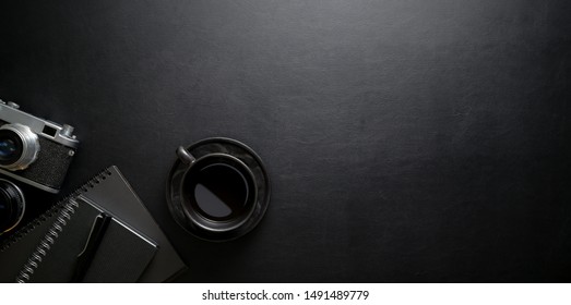 Dark Stylish Workplace With Coffee Cup And Office Supplies On Black Leather Table Background, Top View With Copy Space 