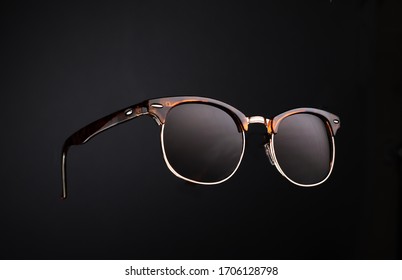 dark sunglasses in dark background fashion