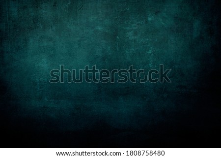 Dark teal canvas grungy background or texture