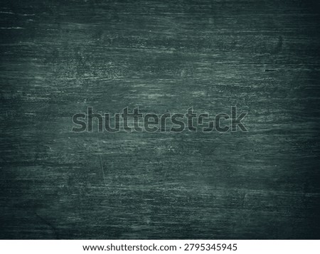 Dark teal-green weathered surface with deep texture, scratches, and a moody vintage finish.