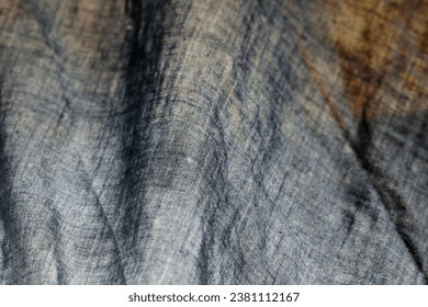 Dark texture with rust-red, warbler, and indigo sheer ethnic tones on a pale linen background.