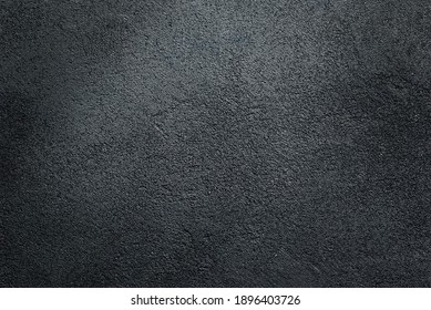 
Dark textured asphalt black background.
 - Shutterstock ID 1896403726