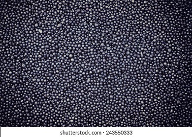 dark textured background, a lot of small balls