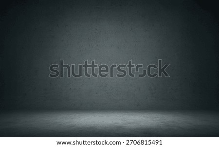 A dark, textured studio backdrop with a soft spotlight illuminating the concrete floor, creating a dramatic atmosphere.
