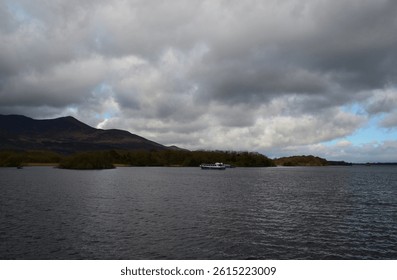 Dark thick clouds hovering over a large body of water in Ireland.