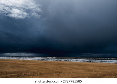 Dark, threatening rain clouds over the beach of Katwijk aan Zee in the Netherlands