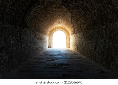 The dark tunnel in the catacomb. light at the end of the tunnel