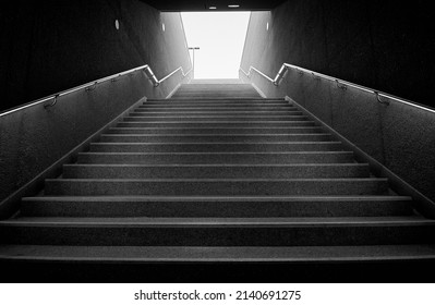 Dark underground stairs leading up into the light. - Powered by Shutterstock