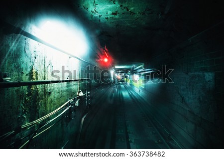 Dark underground tunnel. Grunge processed image with special grain and texture for more dramatic view 