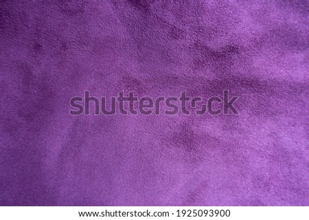 Dark violet faux suede fabric from above