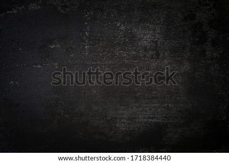 dark wall background. Empty workplace, in front of an abstract package.