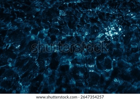 dark water surface with reflection