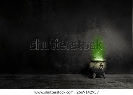 Dark witch cauldron with a magi.c witch's potion in a dark room