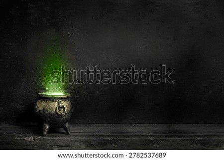 Dark witch cauldron with a magi.c witch's potion in a dark room