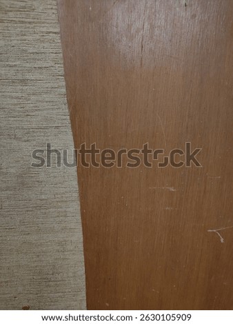 Dark wood texture peels off leaving a light colored wood texture