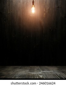 Dark Wooden Background Texture. Wood Shelf, Grunge Industrial Interior With Light Bulb