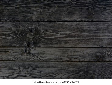 Dark wooden boards, planks. Naturally aged wood, natural brushing process. The top view. Close-up. The stock photos.   - Shutterstock ID 690473623