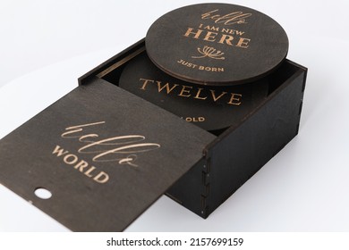 Dark Wooden Box On A White Background With Round Wooden Elements