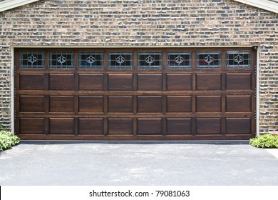 Dark Wooden Garage Door With Brick Wall Background