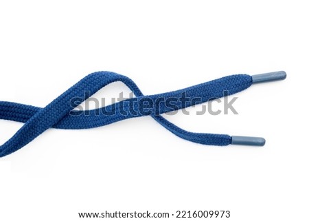 Dark-blue, blue sneakers shoelaces isolated on white, crumpled laces, top view	