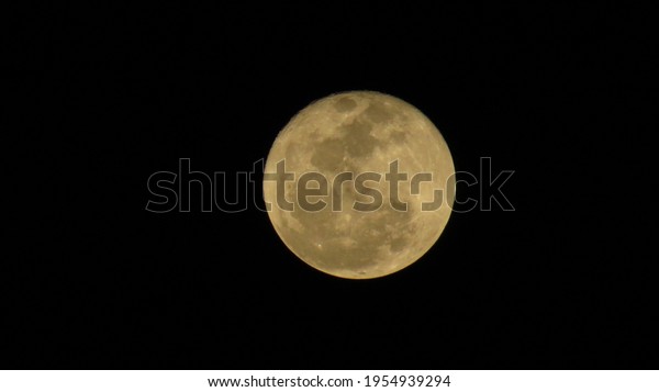 In the darkness of the night there is the moon to\
light the sky
