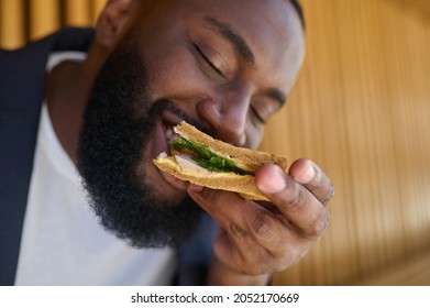 A Dark-skinned Maneating Snadwich With A Big Appetite