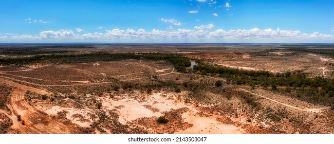 Darling river basin with bended watercourse of main stream in red soil australian outback near Wilcannia town - aerial panorama.