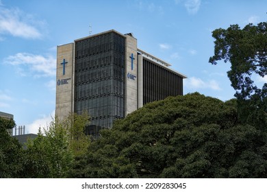 Darlinghurst, Sydney, New South Wales, Australia - October 2 2022: St Vincents Private Hospital With Christian Cross And Framed By Tree Tops