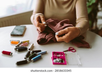 darning an old pullover by hand