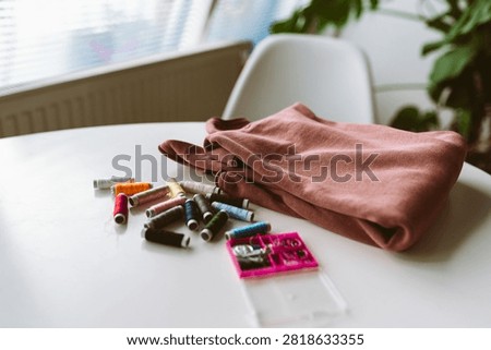darning an old pullover by hand