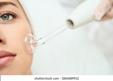 Darsonval cosmetology apparatus. Face cleaning procedure. Salon skincare treatment. Professional dermatology hardware. Electric spa equipment. Medicine patient device. Removal acne
