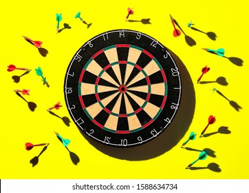 Dart Board Hit Or Miss On Yellow Background