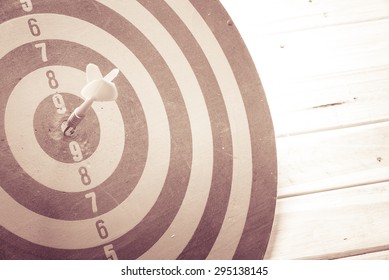 Dart is an opportunity and Dartboard is the target and goal. So both of that represent a challenge - Business concept. Bullseye and Dart.
