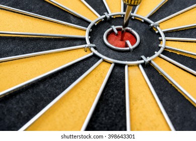 Dart target arrow on the center bullseye of dartboard, Smart goal setting accurate and marketing concept