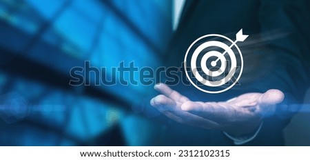 Dartboard with arrow to success concept, businessman showing virtual icon for success and growth of business, challenge in business, financial, investment, social media, digital marketing online.