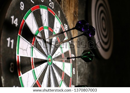 Dartboard with darts, closeup