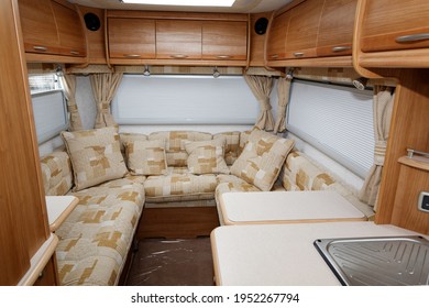 Dartmoor England. Interior Of European Motor Home Camping Car  Showing U Shaped Lounge, Large Windows With Blinds And Overhead Storage Cabinets. Motorhome 