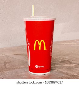 Dartmouth, Canada - July 31, 2016: McDonald's Disposable Cup And Straw. McDonald's Corp Is The Biggest Chain Of Fast Food Restaurants In The World.