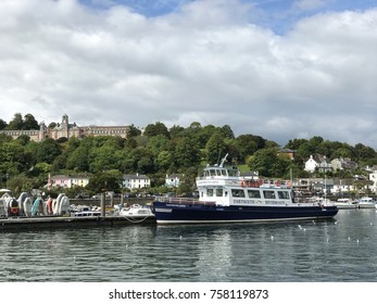 Dartmouth, Devon UK. 30th August 2017. Dartmouth Castle tourist riverboat pleasure cruiser on the River Dart with Dartmouth Britannia Royal Naval College for officer training on the hill to the rear.