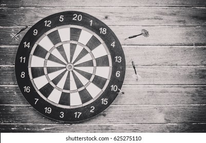 darts arrows missed their target (target) black and white background