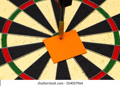 Darts with dart arrow which was pinned a sheet of paper for labels