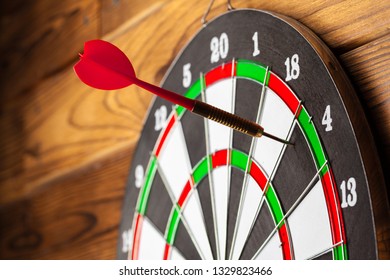 The darts on wooden background - Shutterstock ID 1329823466