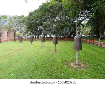 Darwin, Northern Territory, Australia 2/20/2018. Civic Square Darwin Featuring HMS Beagle Ship Bell Chime And Other Bells Forming Musical Instrument Accessible To The Public. Also Tree Of Knowledge.