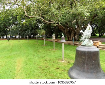 Darwin, Northern Territory, Australia 2/20/2018. Civic Square Darwin Featuring HMS Beagle Ship Bell Chime And Other Bells Forming Musical Instrument Accessible To The Public. Also Tree Of Knowledge.