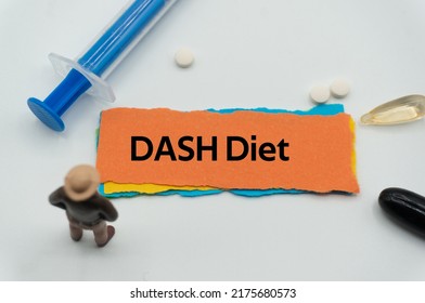 DASH Diet.The word is written on a slip of colored paper. health terms, health care words, medical terminology. wellness Buzzwords. disease acronyms.