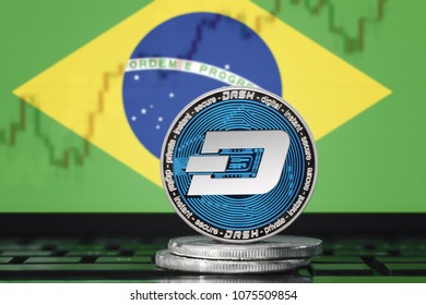 DASH (DigitalCash) cryptocurrency; concept physical dash coin on the background of the flag of BRAZIL