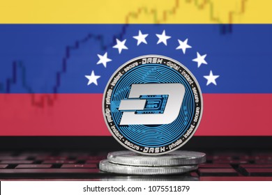 DASH (DigitalCash) cryptocurrency; concept physical dash coin on the background of the flag of Venezuela