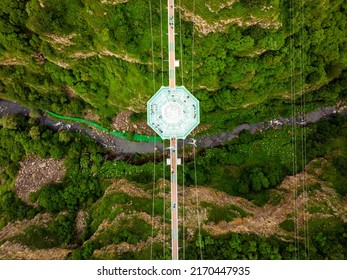 Dashbashi, Georgia - 19th June, 2022: Aerial Circle Over Diamond Cafe On Glass Bridge Over Scenic Dashbashi Valley In Georgia Countryside. Famous Modern Bridge Over Valley